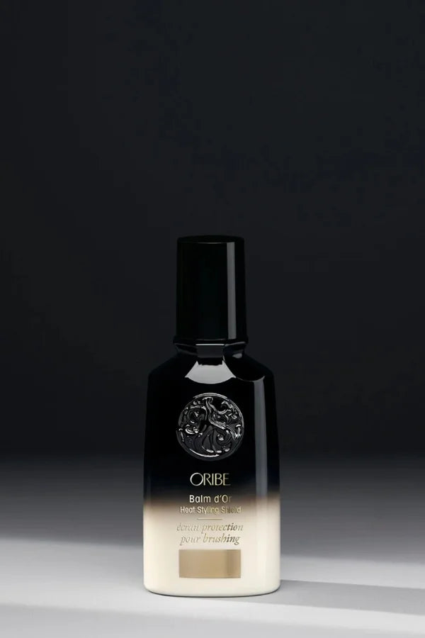 A standard 100 ml bottle of Oribe Balm d'Or Heat Styling Shield