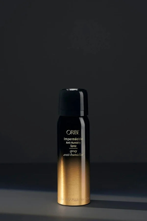A travel size 75 ml Oribe Imperméable Anti-Humidity Spray