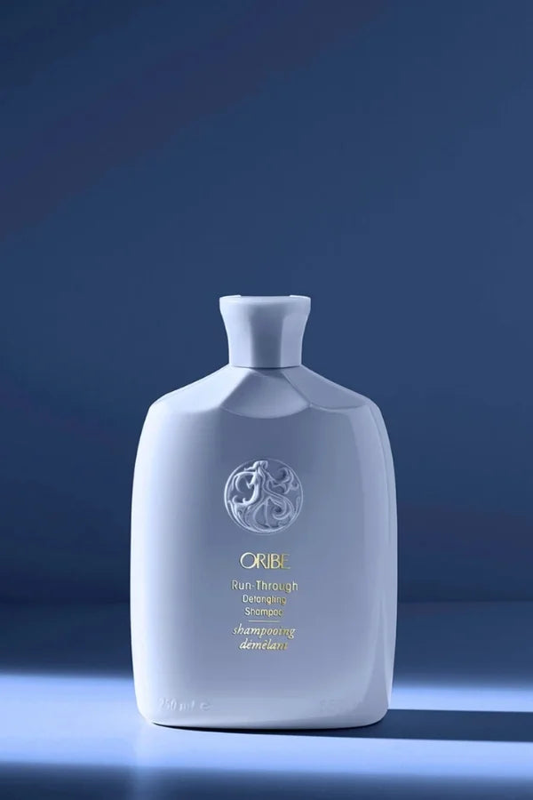 A standard 250 ml bottle of Run-Through Detangling Shampoo