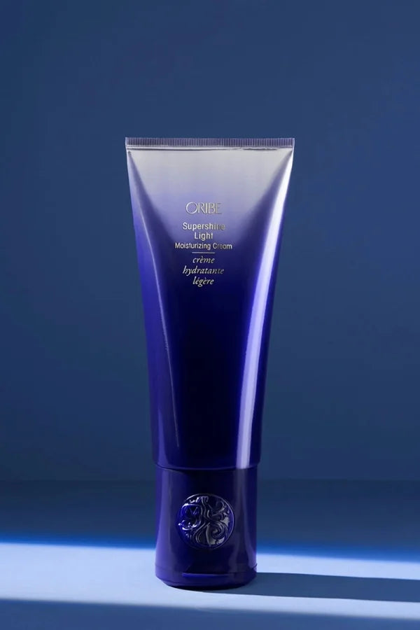A standard 150 ml size cream of Oribe Supershine Light Moisturizing Cream