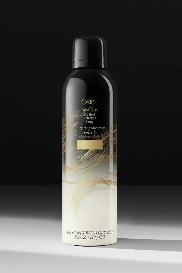 A standard 250 ml spray can of Gold Lust Dry Heat Protection Spray