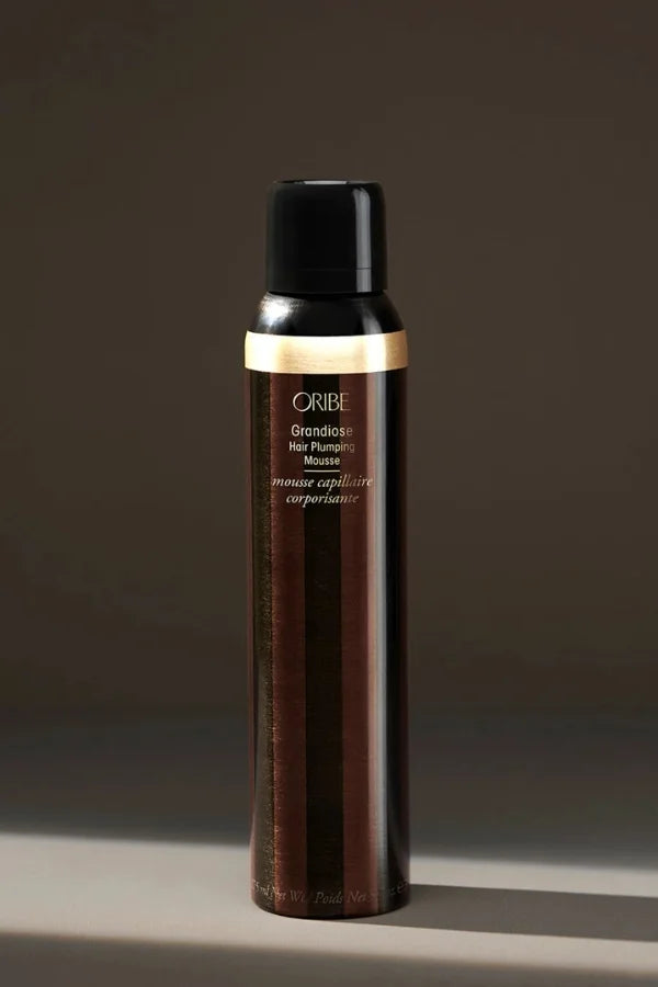 A standard 5.7 oz bottle of Grandiose Hair Plumping Mousse