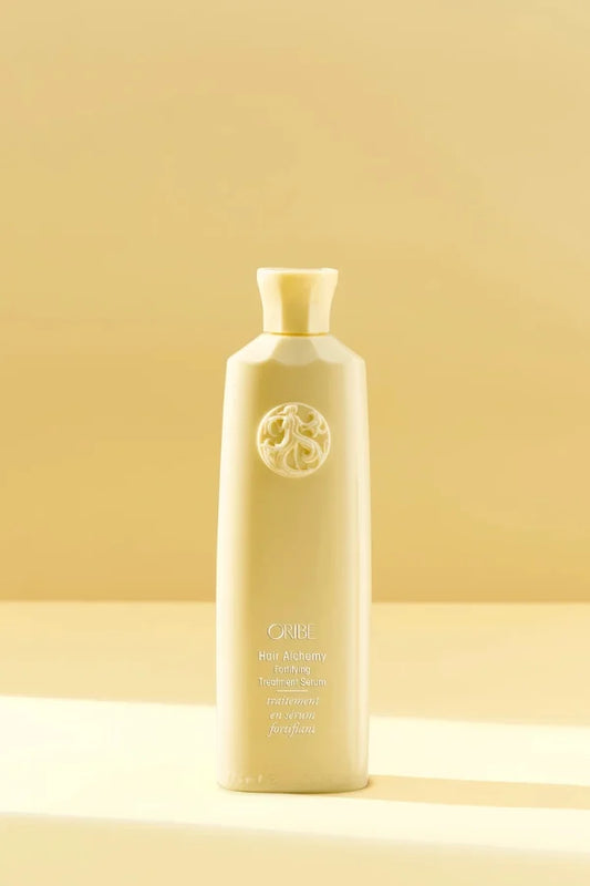 A standard 175 ml bottle of Hair Alchemy Fortifying Treatment Serum