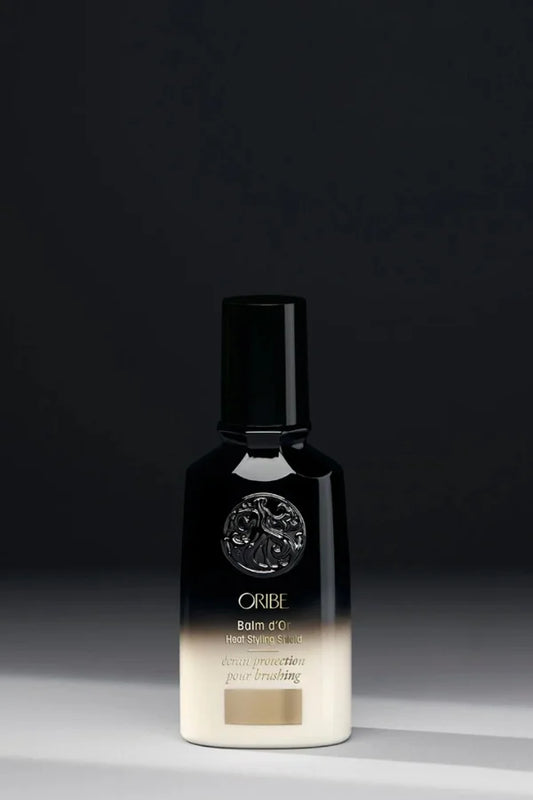 A standard 100 ml bottle of Oribe Balm d'Or Heat Styling Shield