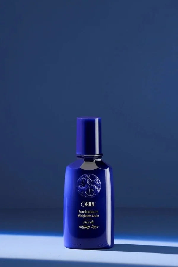 A 100 ml sized product of Oribe Featherbalm Weightless Styler