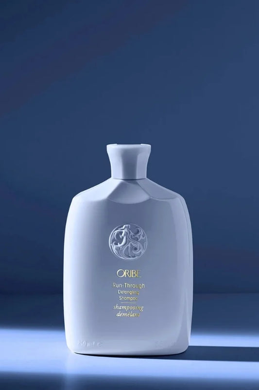 A standard 250 ml bottle of Run-Through Detangling Shampoo